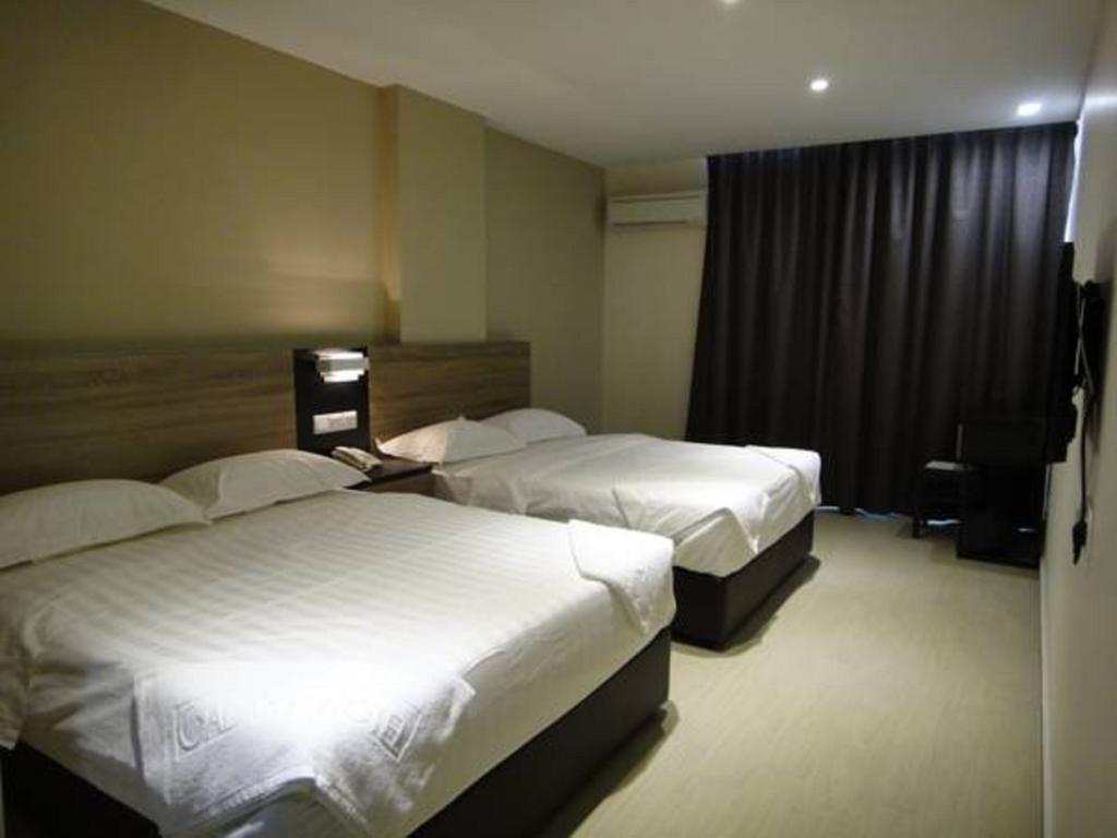 Galaxy Hotel Simpang Ampat  Номер фото